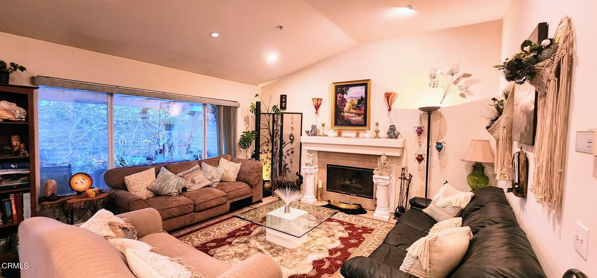 1500 Gabriella Drive Oxnard, CA 93030 - Photo 5 of 23 a living room with furniture a fireplace and a flat screen tv