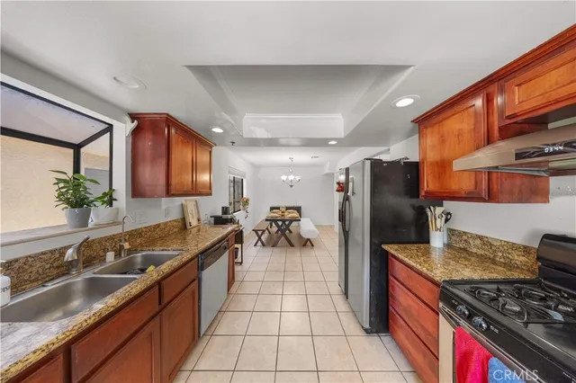a kitchen with a sink and a stove top oven