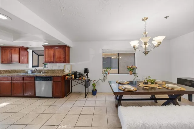 a living room with granite countertop furniture and kitchen view