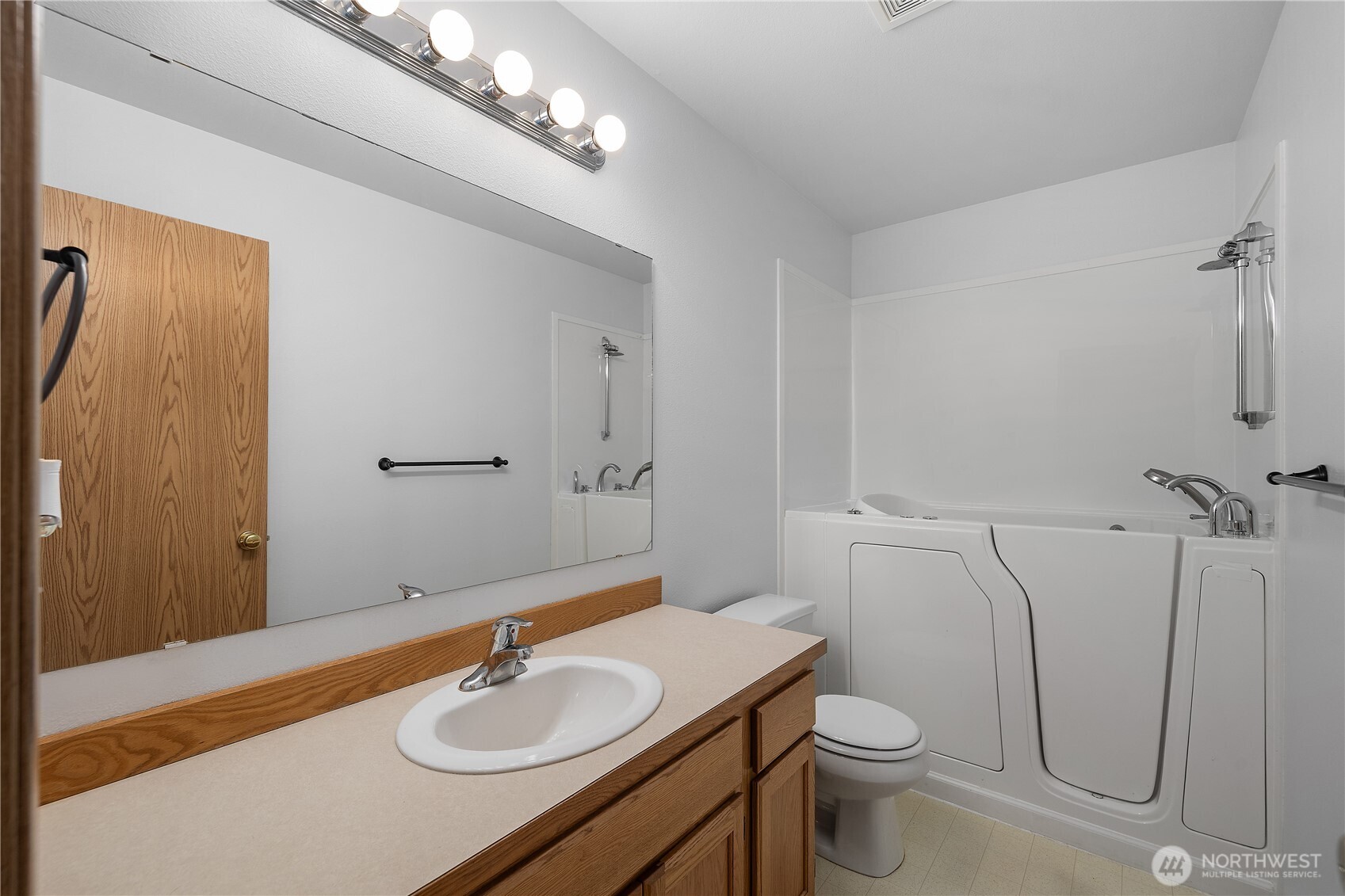 7606 187th Avenue Southwest Rochester, WA 98579 - Photo 21 of 28 a bathroom with a sink toilet and shower