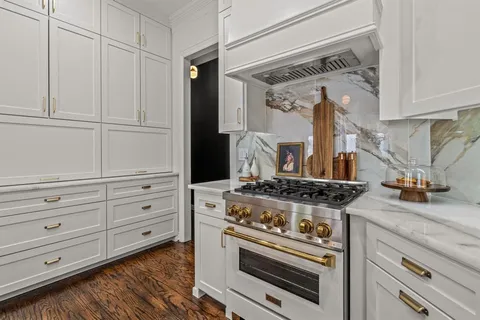 a kitchen with appliances and cabinets