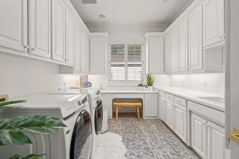 a kitchen that has a sink and a stove in it