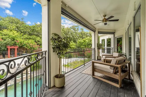 a view of a balcony with furniture