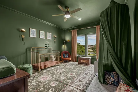 a bedroom with furniture and a window