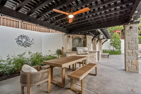 a view of a house with pool and chairs