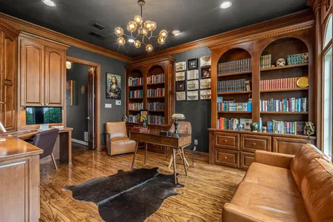 a living room with furniture or chandelier and a rug