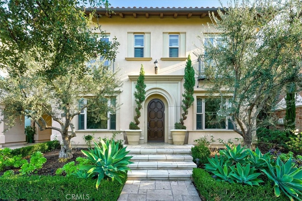 72 Clifford Irvine, CA 92618 - Photo 1 of 65 a front view of a house with a garden