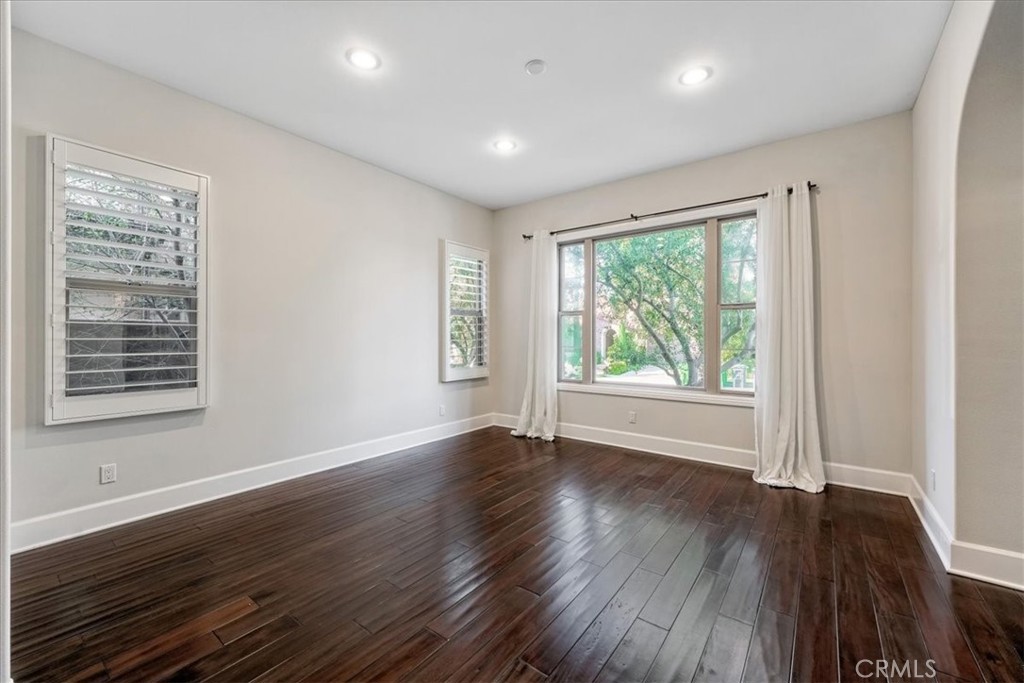 72 Clifford Irvine, CA 92618 - Photo 12 of 65 a view of an empty room with wooden floor and a window