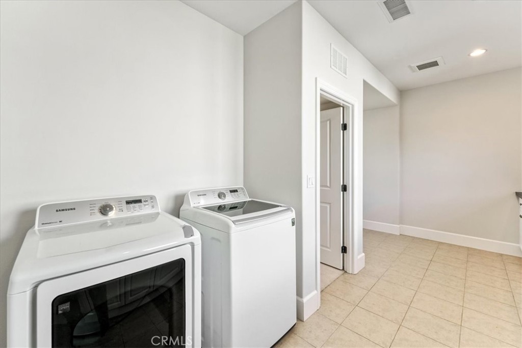 72 Clifford Irvine, CA 92618 - Photo 60 of 65 a utility room with dryer and washer
