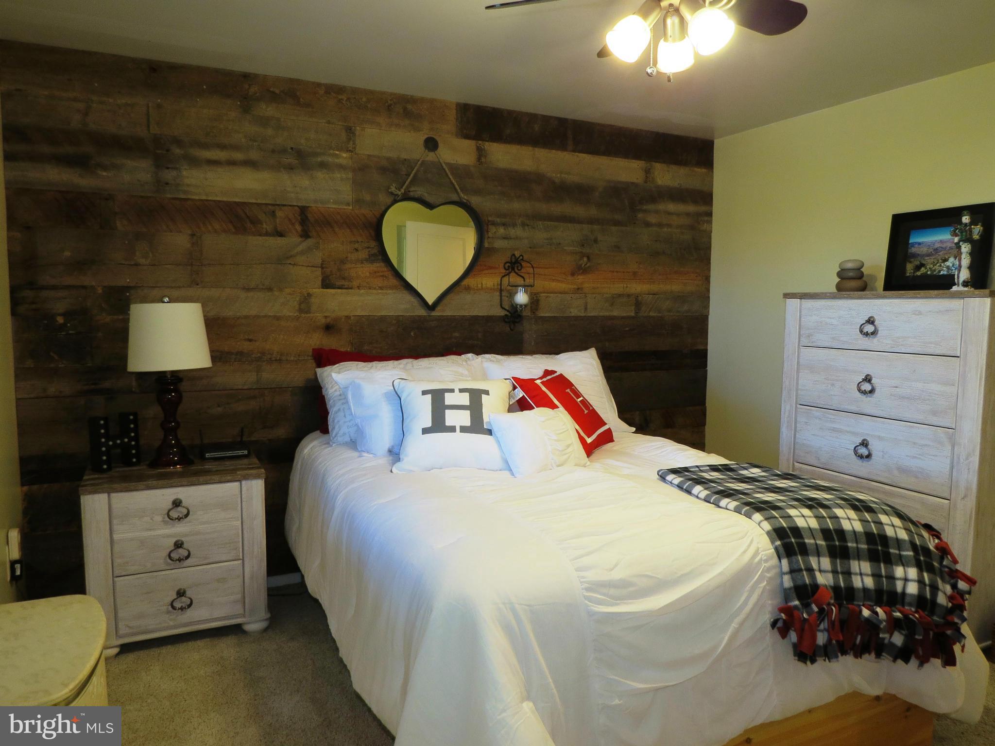 3313 Maple Grove Road Hampstead, MD 21074 - Photo 15 of 30 a bedroom with a bed and wooden floor
