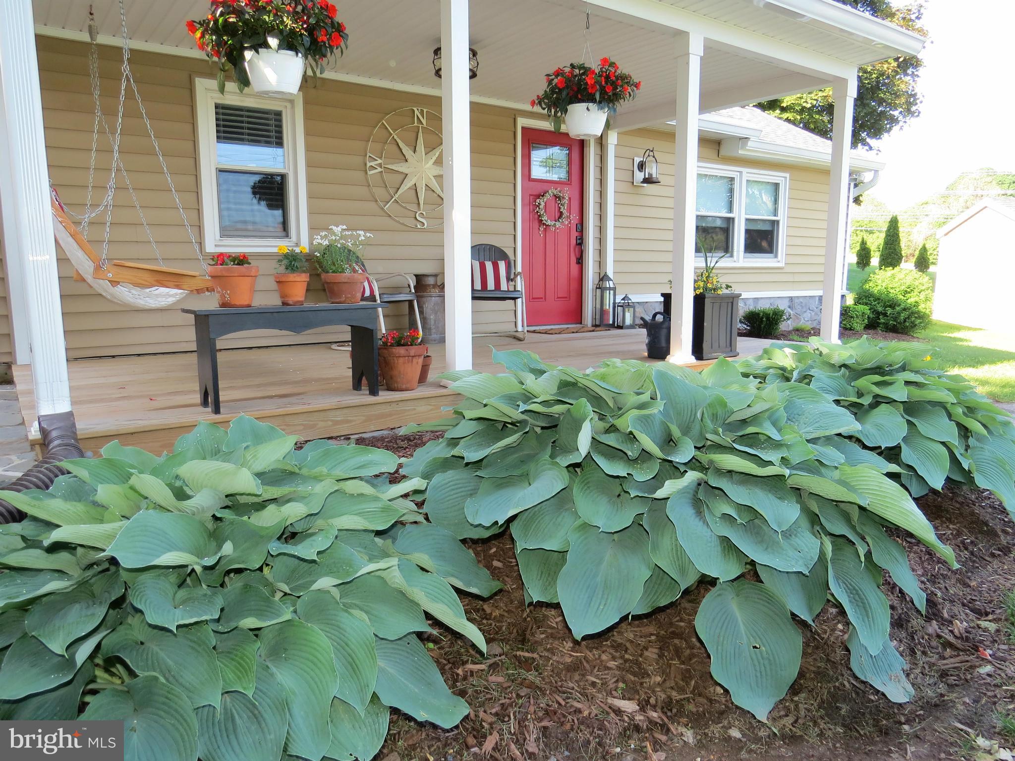 3313 Maple Grove Road Hampstead, MD 21074 - Photo 26 of 30 a plant that is sitting in front of a house