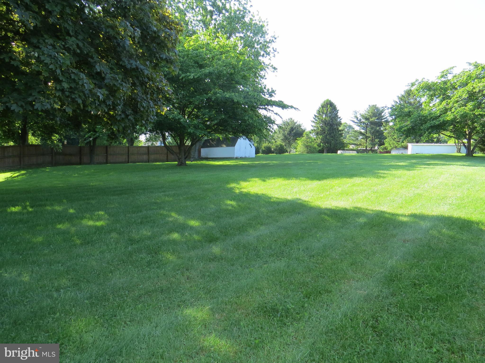 3313 Maple Grove Road Hampstead, MD 21074 - Photo 29 of 30 a view of grassy field with benches