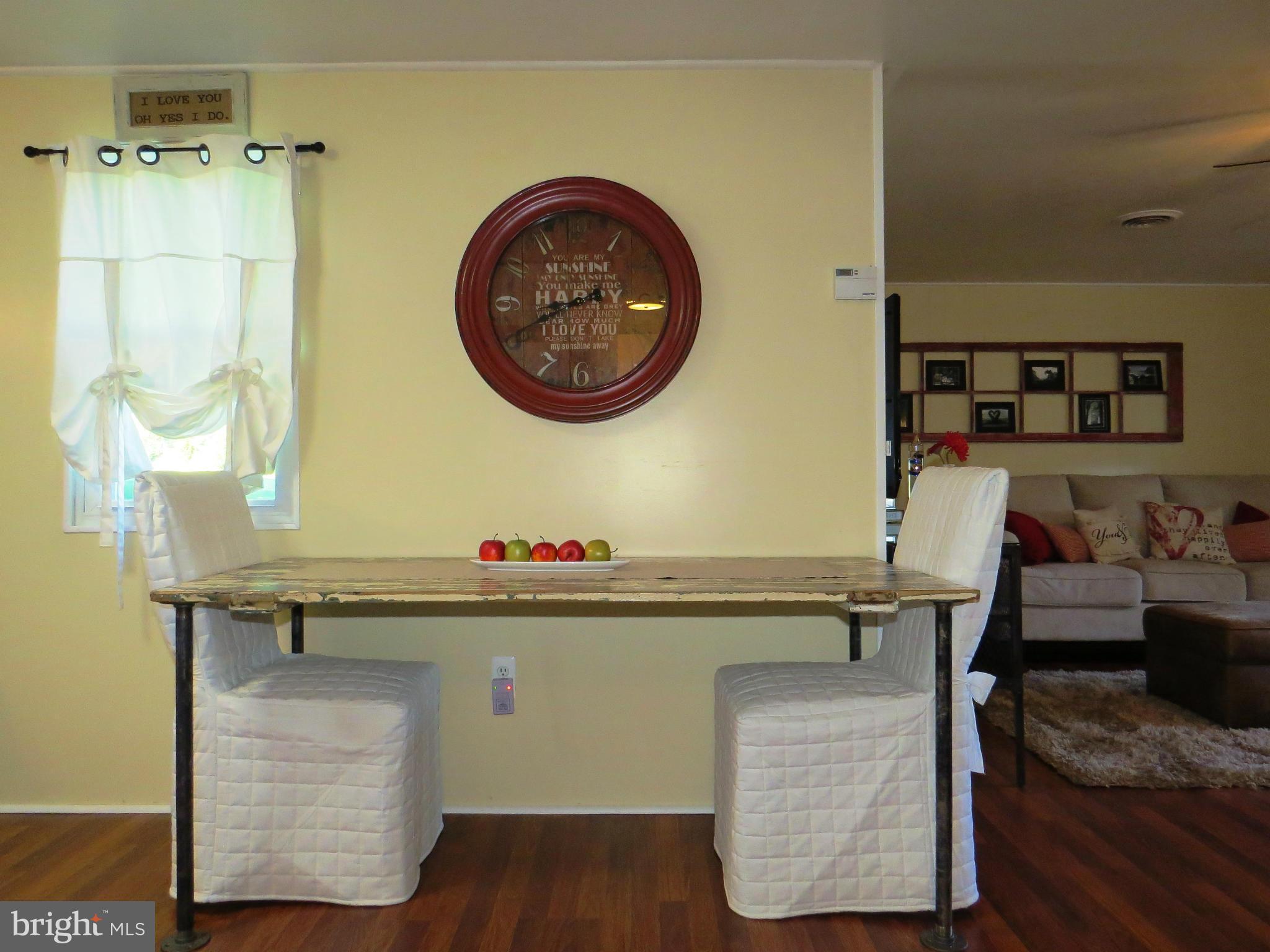 3313 Maple Grove Road Hampstead, MD 21074 - Photo 7 of 30 a room with a table and a chair