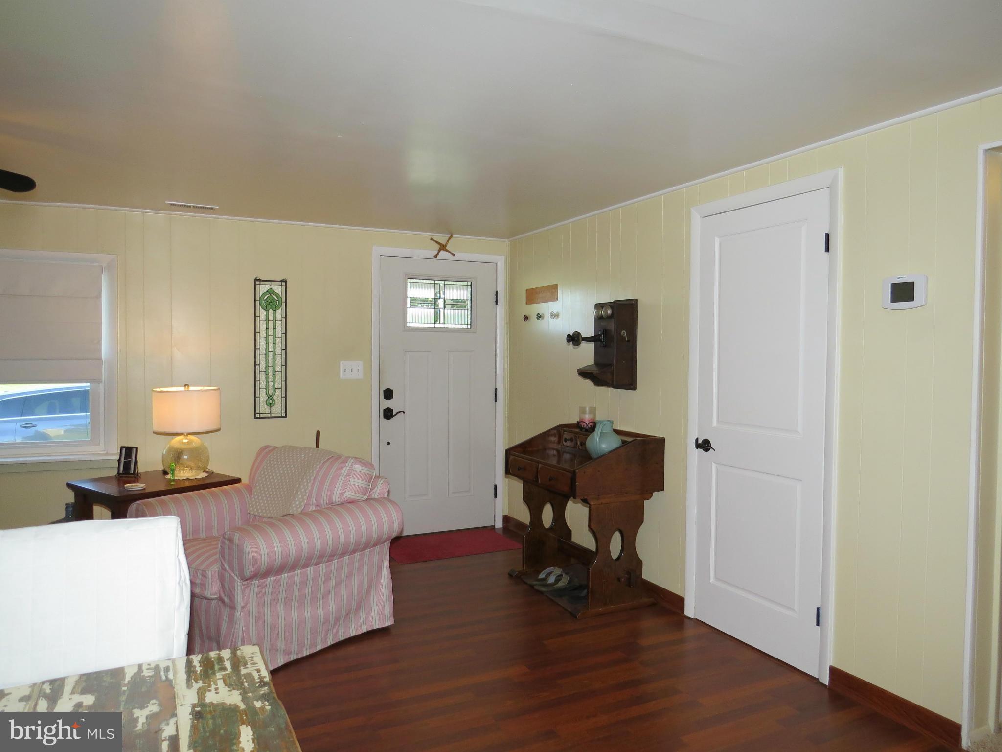 3313 Maple Grove Road Hampstead, MD 21074 - Photo 10 of 30 a living room with furniture and a wooden floor
