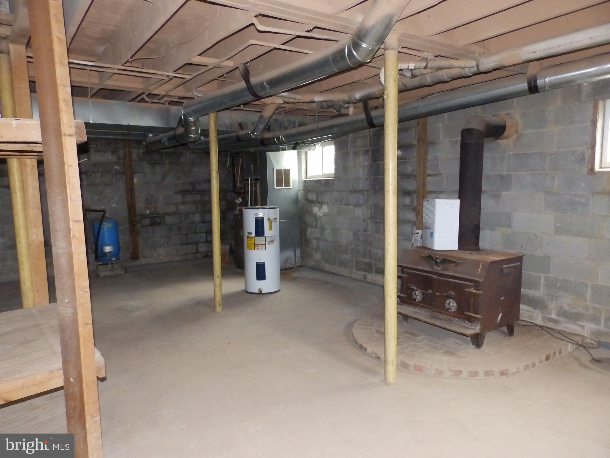 15125 Barnes Road New Windsor, MD 21776 - Photo 30 of 35 Basement with Wood Stove