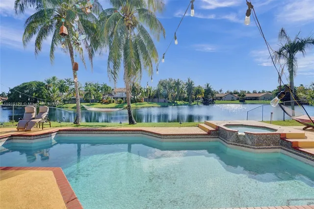 a view of a swimming pool with a lounge chairs