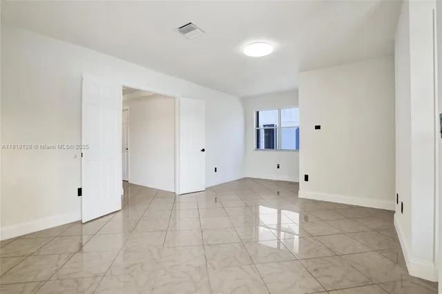 a view of a kitchen with an empty space