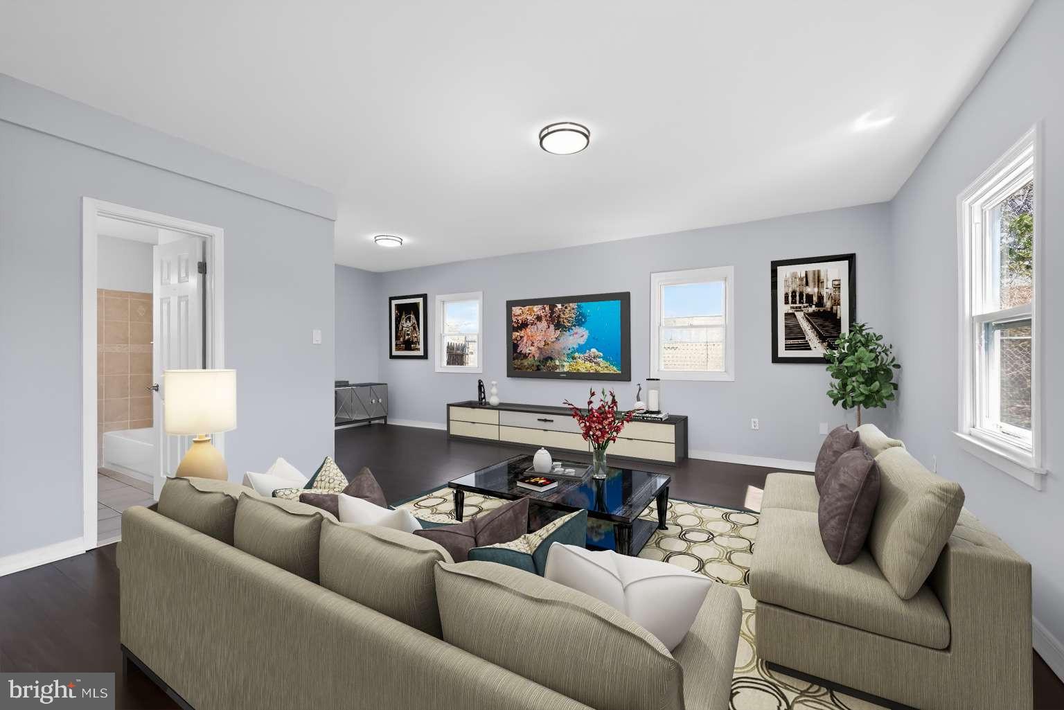 916 Stephen Avenue Croydon, PA 19021 - Photo 2 of 34 a living room with furniture and a flat screen tv