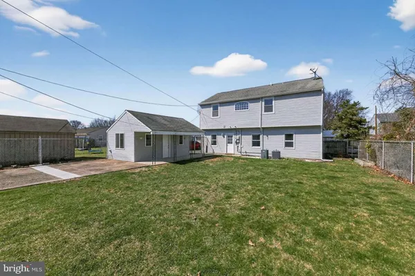 a front view of a house with a yard and porch