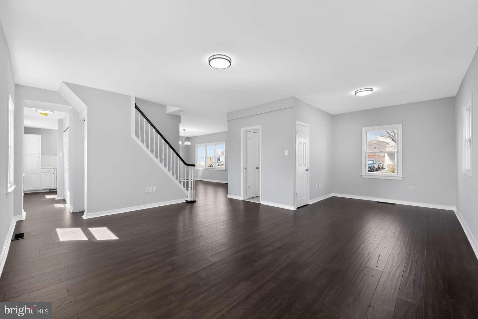 916 Stephen Avenue Croydon, PA 19021 - Photo 3 of 34 an empty room with wooden floor and windows