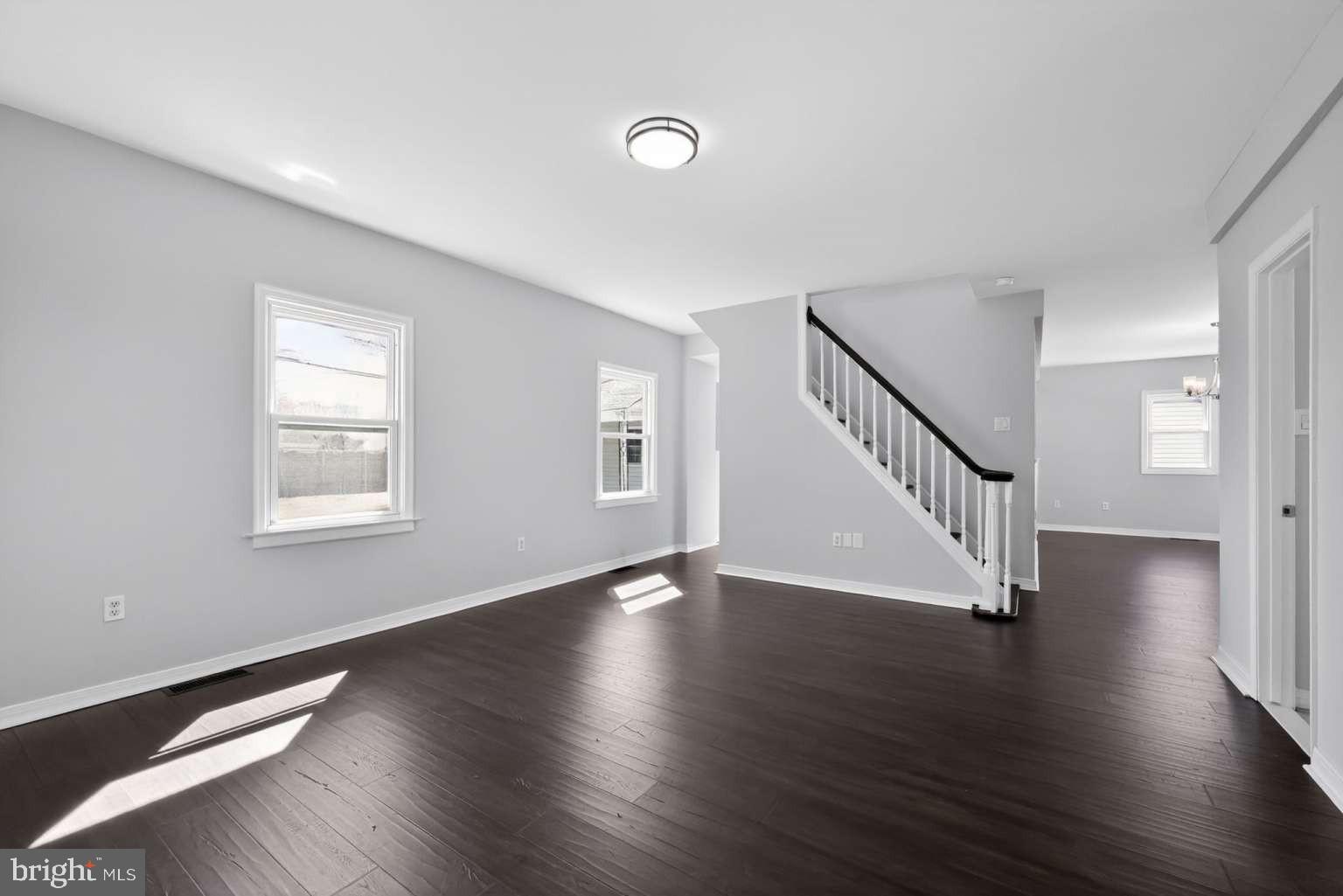 916 Stephen Avenue Croydon, PA 19021 - Photo 4 of 34 a view of an empty room with wooden floor and a window