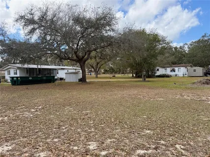 a view of a yard with a house