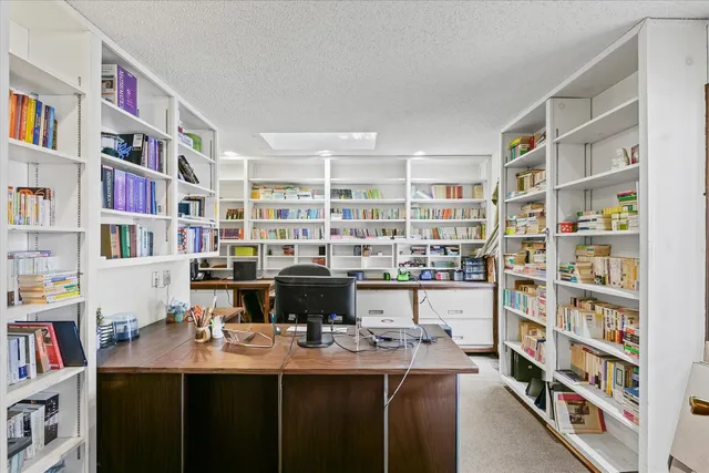 a view of a workspace with furniture and toys