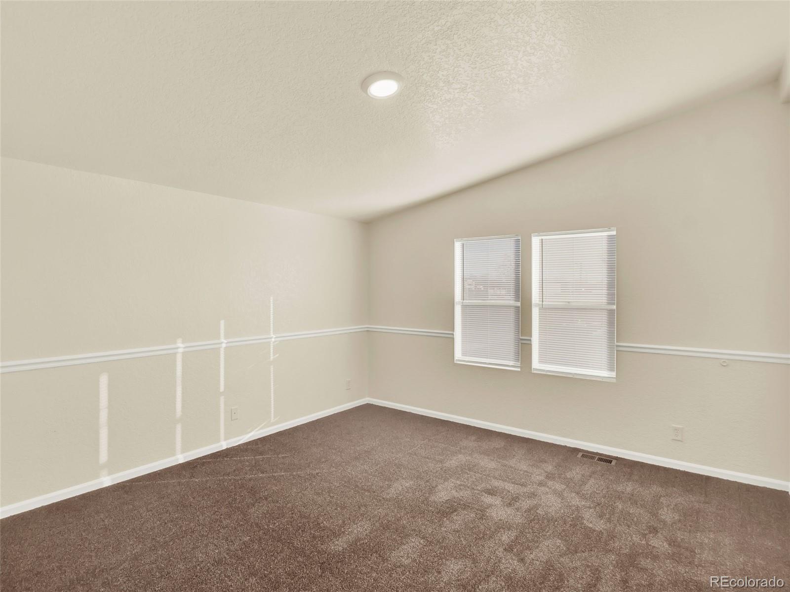 7798 Richard Avenue Fort Lupton, CO 80621 - Photo 25 of 45 an empty room with a window