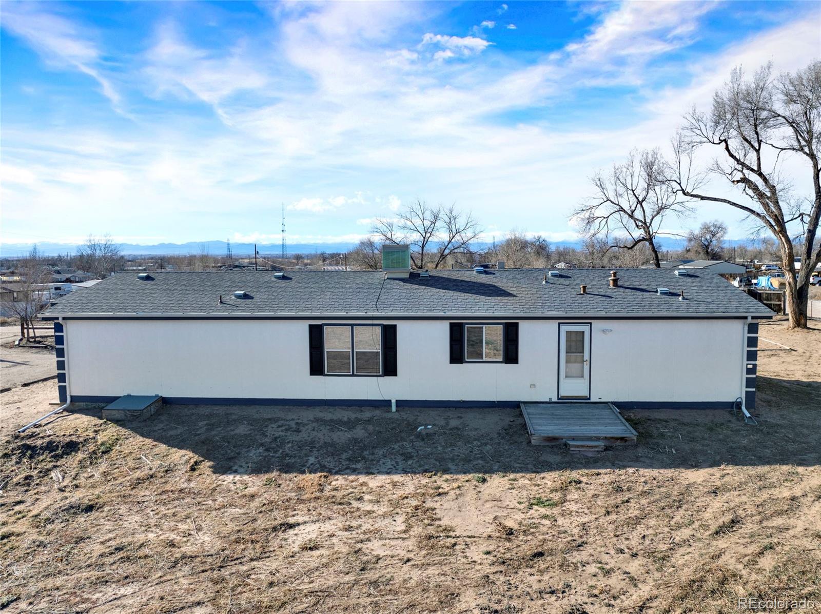 7798 Richard Avenue Fort Lupton, CO 80621 - Photo 41 of 45 a view of a dry yard with wooden fence