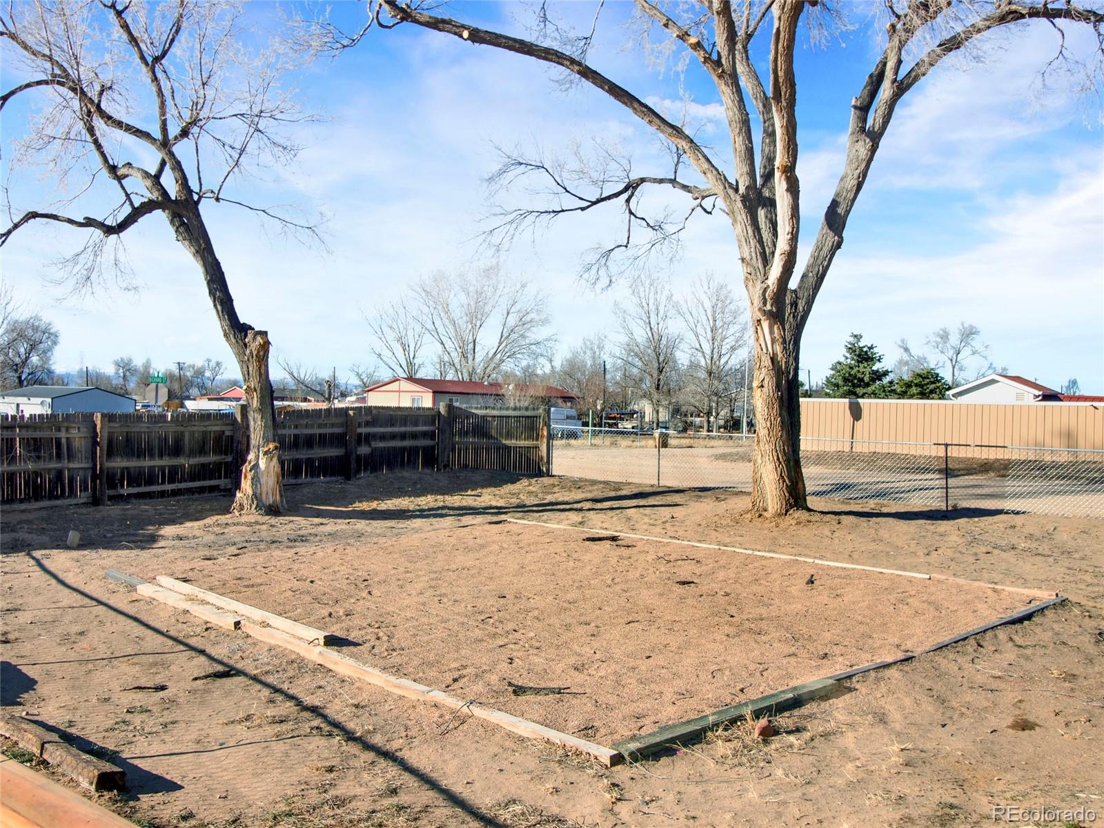 7798 Richard Avenue Fort Lupton, CO 80621 - Photo 5 of 45 a view of a yard with snow on the road