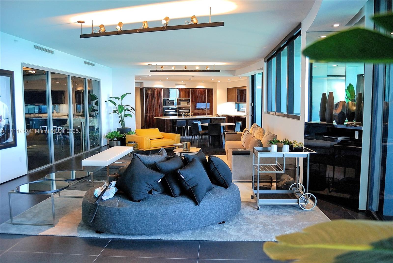 18555 Collins Avenue, Unit 3005 Sunny Isles Beach, FL 33160 - Photo 11 of 57 a outdoor living space with furniture and a potted plant