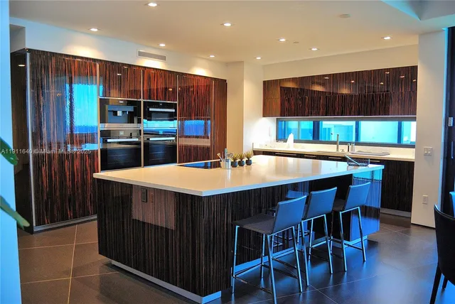 a bedroom with a bed and flat screen tv