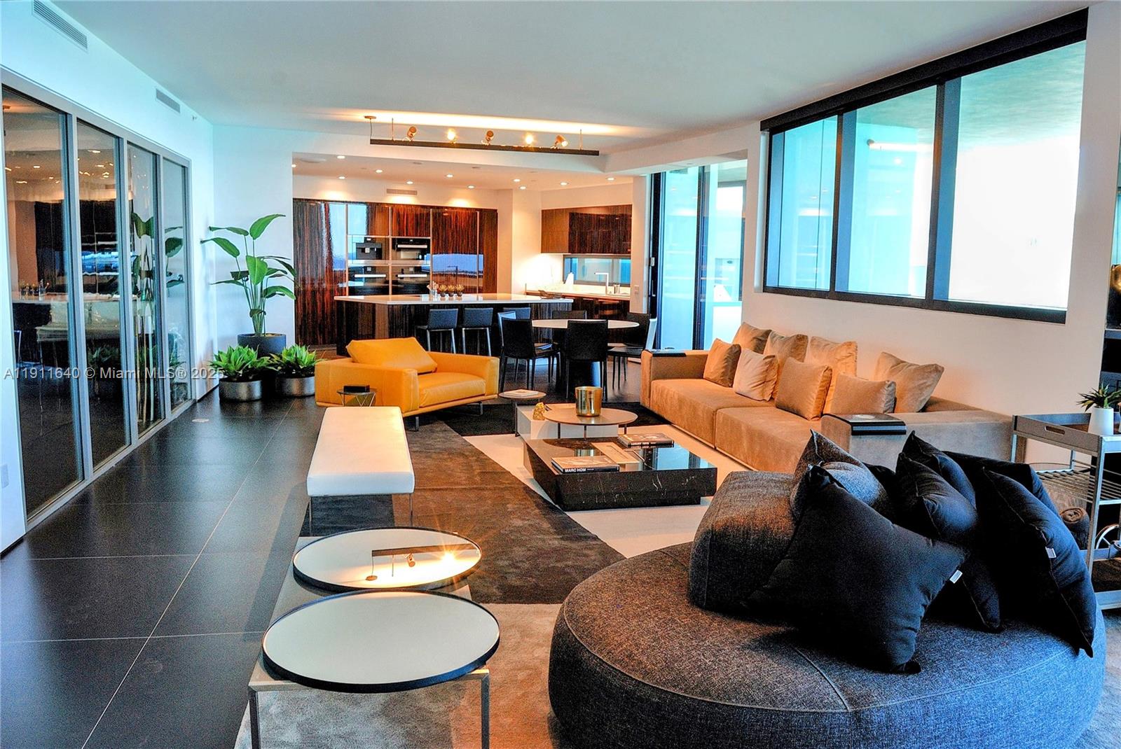 18555 Collins Avenue, Unit 3005 Sunny Isles Beach, FL 33160 - Photo 13 of 57 a living room with furniture and a large window