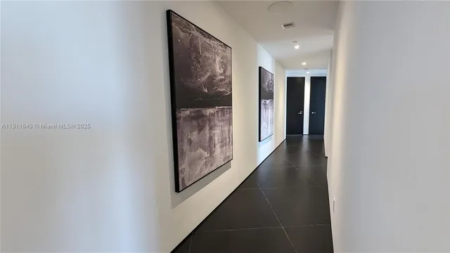 a view of a backyard with a garden and palm trees