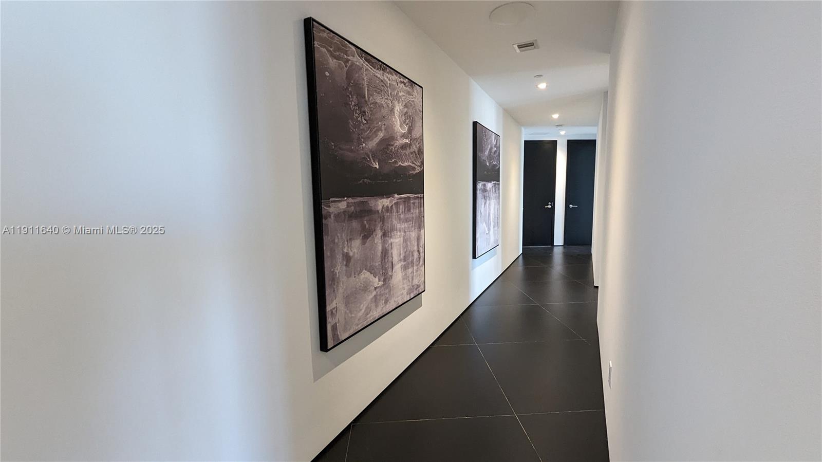 18555 Collins Avenue, Unit 3005 Sunny Isles Beach, FL 33160 - Photo 19 of 57 a view of gallery with wooden floor