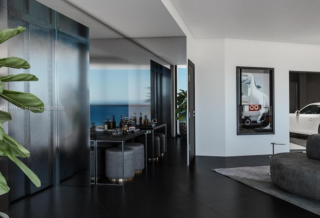 18555 Collins Avenue, Unit 3005 Sunny Isles Beach, FL 33160 - Photo 51 of 57 a kitchen with a refrigerator and a stove top oven