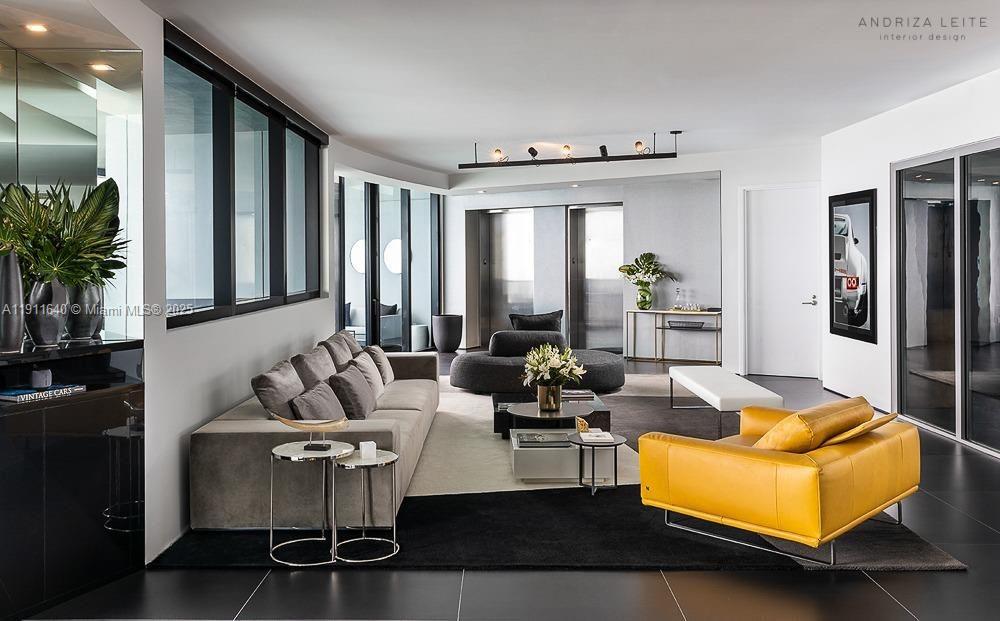 18555 Collins Avenue, Unit 3005 Sunny Isles Beach, FL 33160 - Photo 54 of 57 a living room with furniture and a large window