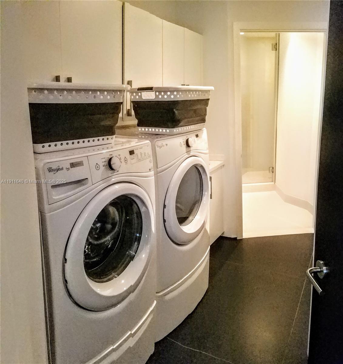 18555 Collins Avenue, Unit 3005 Sunny Isles Beach, FL 33160 - Photo 57 of 57 a utility room with dryer and washer