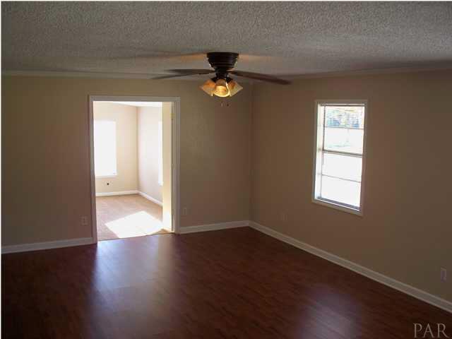 8230 Parker Road Milton, FL 32570 - Photo 6 of 15 LR with New laminate wood flooring