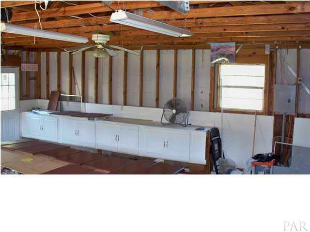 8230 Parker Road Milton, FL 32570 - Photo 10 of 15 3 car garage with cabinets
