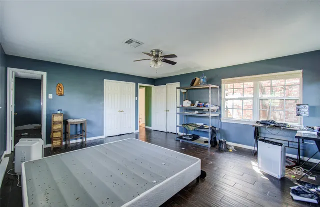 a view of a house with yard and tree s