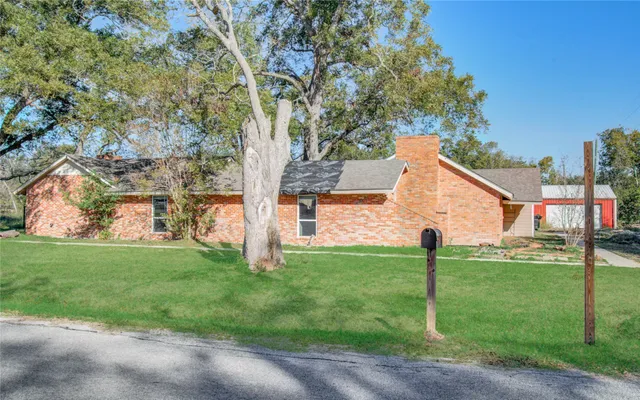 a living room with furniture fireplace and a window