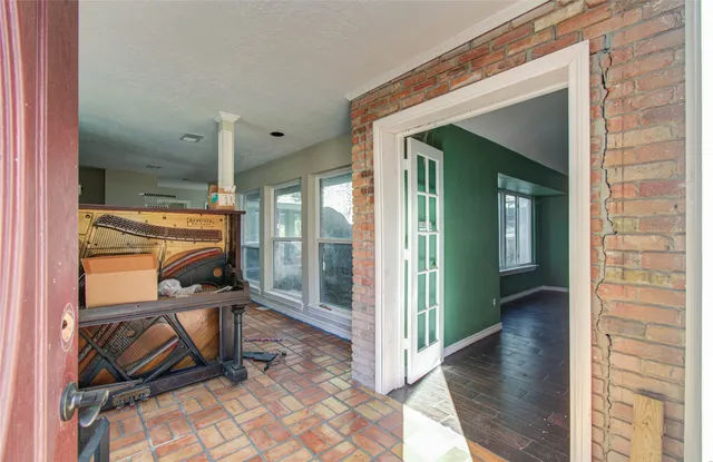 a kitchen with granite countertop a sink stove and cabinets