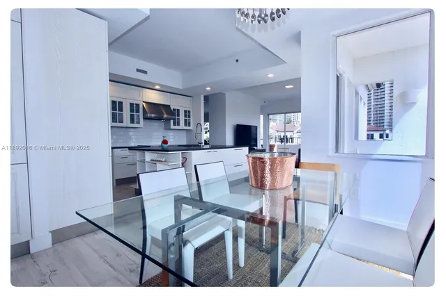 a bedroom with a bed and a large mirror