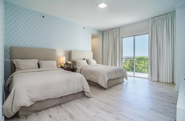 a bathroom with a bathtub sink and a mirror