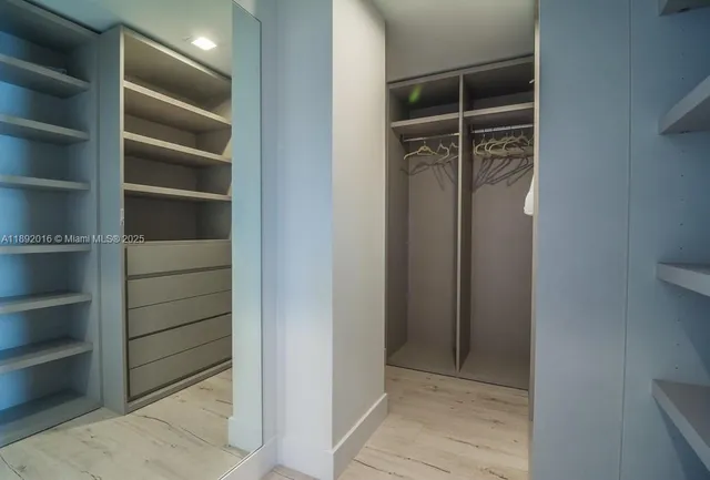 a bathroom with a toilet sink and shower