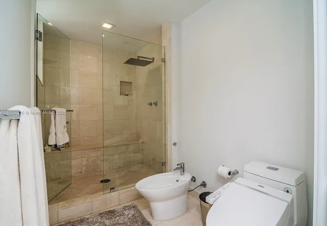 a bedroom with a bed and a table