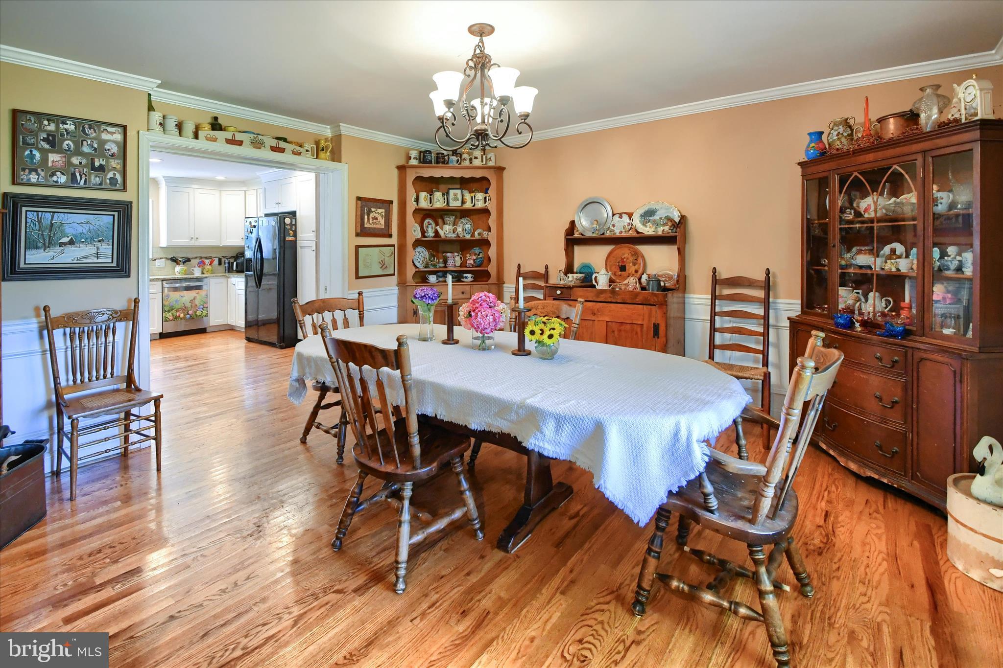 1010 Sweetbriar Road Perkasie, PA 18944 - Photo 11 of 59 a view of a dining room with furniture and wooden floor