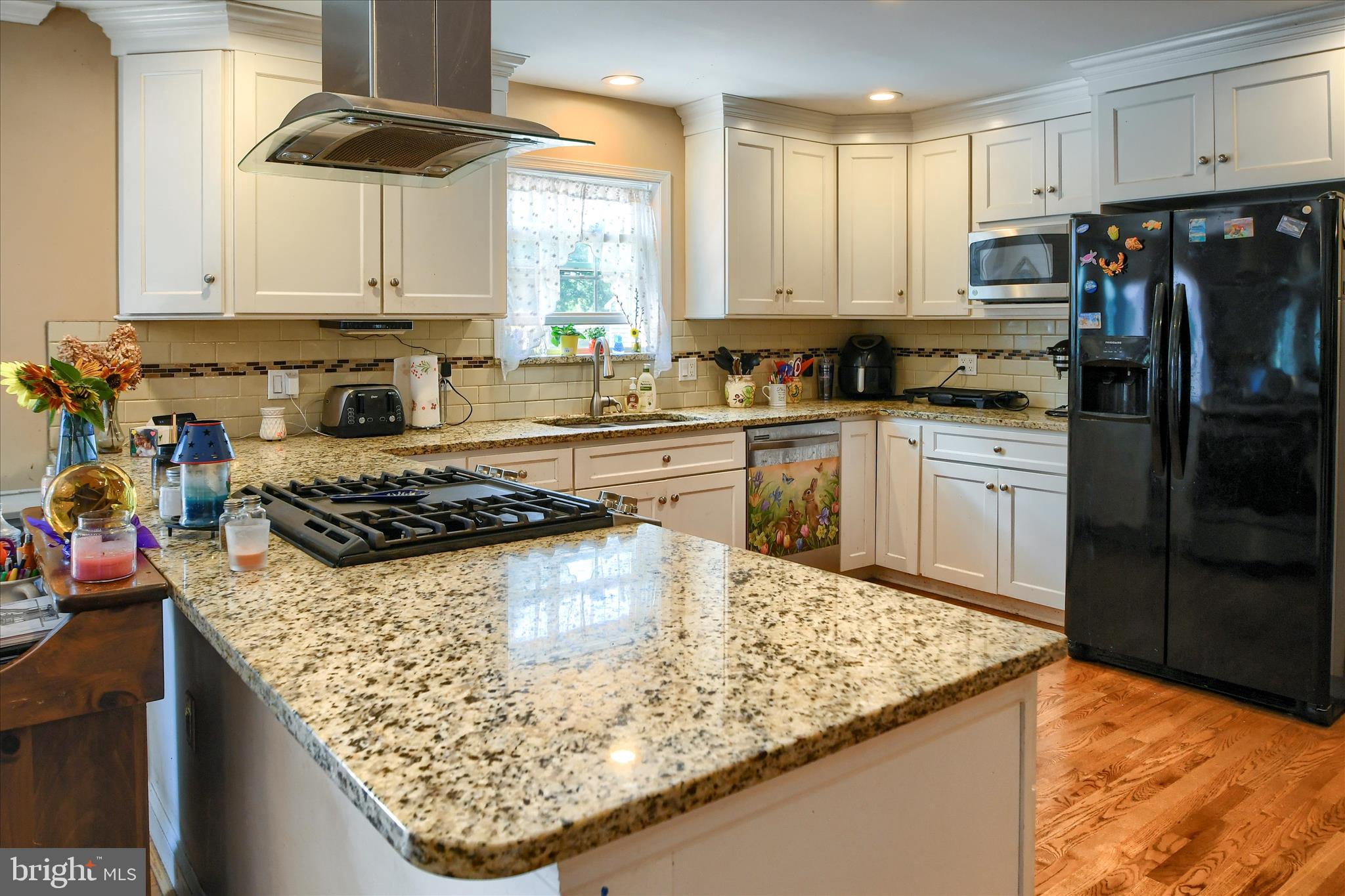 1010 Sweetbriar Road Perkasie, PA 18944 - Photo 15 of 59 a kitchen with stainless steel appliances granite countertop a sink stove and refrigerator