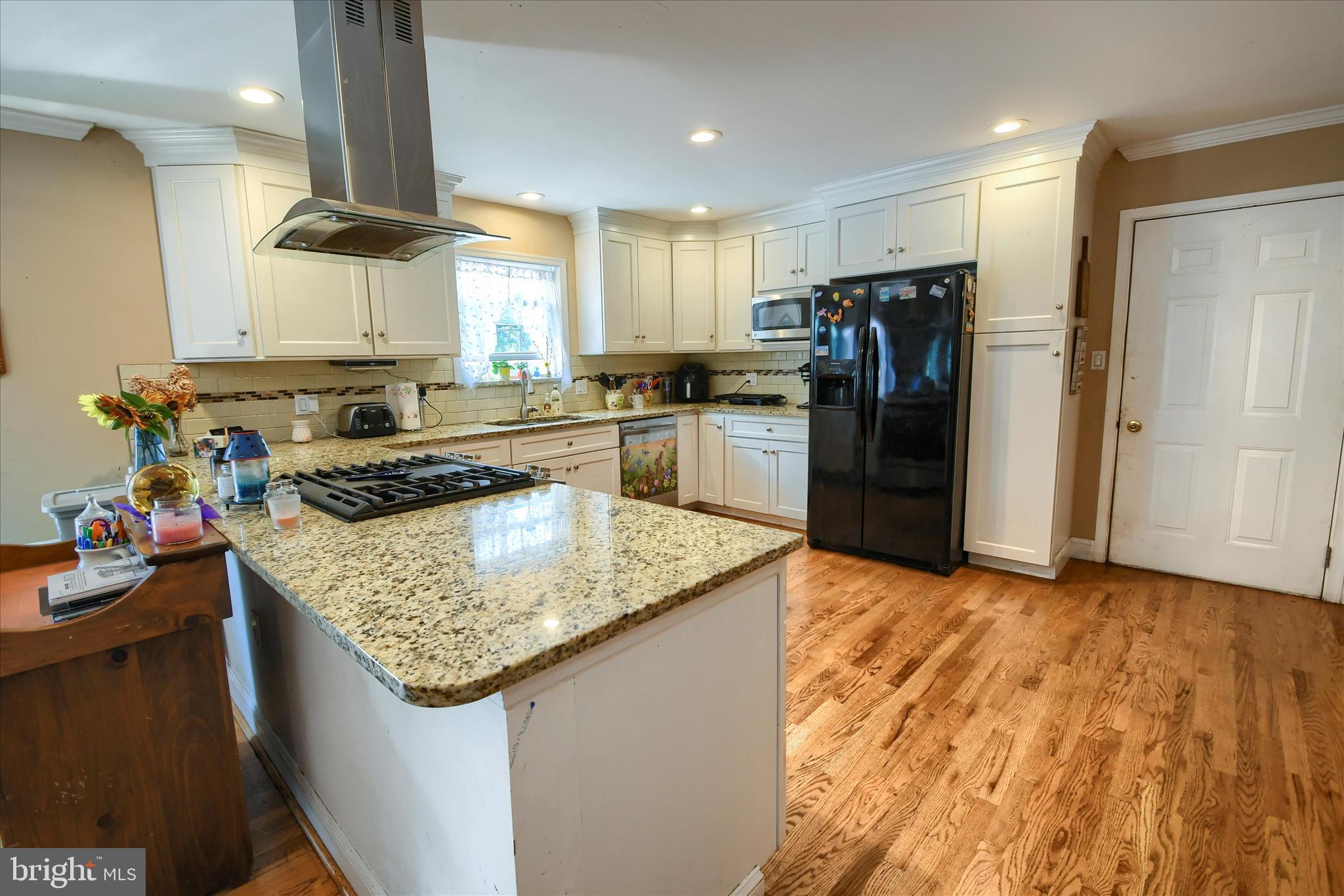 1010 Sweetbriar Road Perkasie, PA 18944 - Photo 16 of 59 a kitchen with stainless steel appliances granite countertop a sink stove and refrigerator
